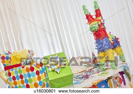 Group of gifts and birthday cake on table View Large Photo Image Stock Image - Group of gifts and birthday cake on table. Fotosearch