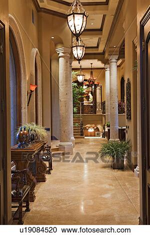 Lights hanging in hallway of luxury mansion View Large Photo Image Stock Image - Lights hanging in hallway of luxury mansion. Fotosearch