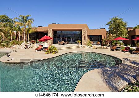 Luxurious swimming pool outside villa View Large Photo Image Picture - Luxurious swimming pool outside villa. Fotosearch