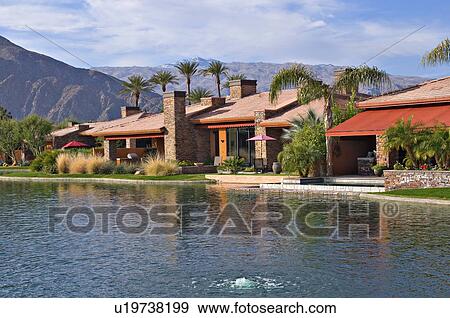 Luxury manor house with lake in foreground View Large Photo Image Stock Photo - Luxury manor house with lake in foreground. Fotosearch