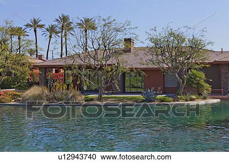 Luxury manor house with swimming pool in foreground View Large Photo Image Stock Image - Luxury manor house with swimming pool in foreground. Fotosearch