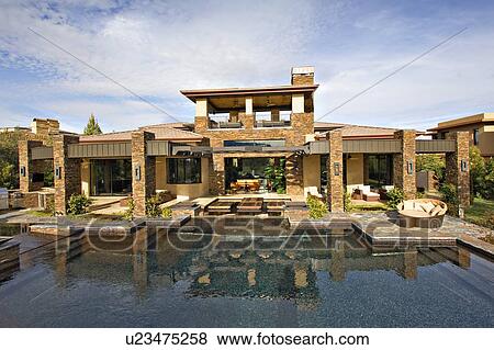 Luxury manor house with swimming pool in foreground View Large Photo Image Stock Photo - Luxury manor house with swimming pool in foreground. Fotosearch