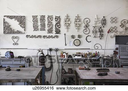 Metal designs on wall in workshop View Large Photo Image Stock Photograph - Metal designs on wall in workshop. Fotosearch