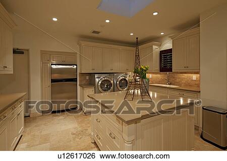 Stock Photograph - Modern kitchen counter with showpiece in manor house. Fotosearch