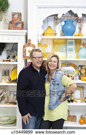 Portrait of a cheerful mature couple in cafe View Large Photo Image Stock Photo - Portrait of a cheerful mature couple in cafe. Fotosearch