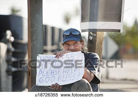 Portrait of a homeless person with sign paper View Large Photo Image Stock Photography - Portrait of a homeless person with sign paper. Fotosearch