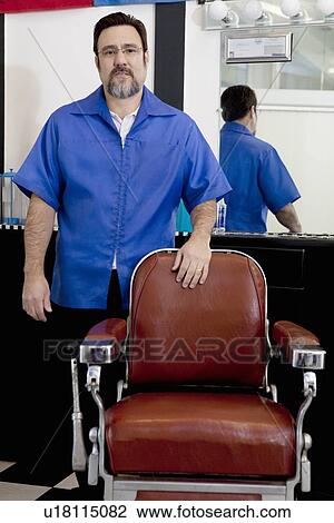 Portrait of a mature barber standing near seat View Large Photo Image Stock Image - Portrait of a mature barber standing near seat. Fotosearch