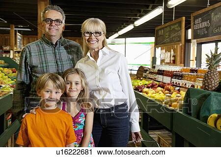 Portrait of a senior couple with grandchildren in farmer's market View Large Photo Image Stock Image - Portrait of a senior couple with grandchildren in farmer's market. Fotosearch