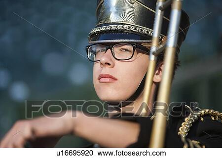 Portrait of a teenage boy with trombone View Large Photo Image Stock Image - Portrait of a teenage boy with trombone. Fotosearch