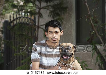 Stock Photograph - Portrait of a young man with boxer. Fotosearch