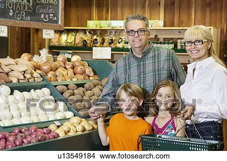 Portrait of happy grandparents with children in market View Large Photo Image Picture - Portrait of happy grandparents with children in market. Fotosearch
