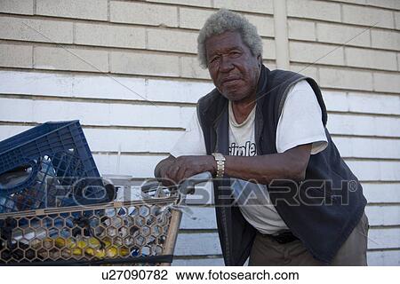 Portrait of homeless African American man with shopping cart View Large Photo Image Stock Image - Portrait of homeless African American man with shopping cart. Fotosearch