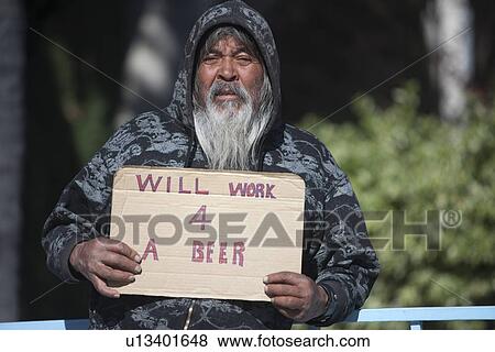 Stock Photo - Portrait of senior homeless man with placard. Fotosearch
