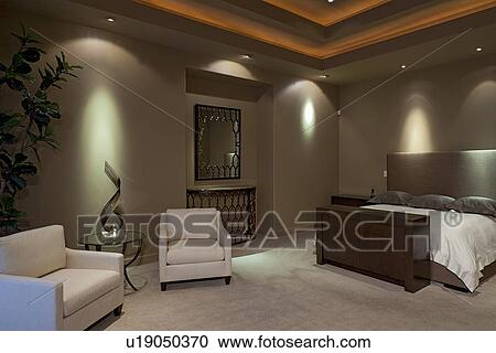 Stock Image - Seating furniture in bedroom of manor house. Fotosearch