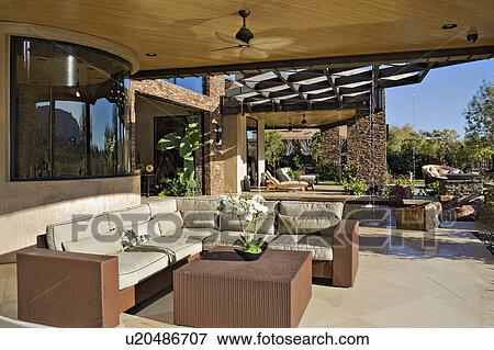 Seating furniture in luxurious patio of manor house View Large Photo Image Stock Photo - Seating furniture in luxurious patio of manor house. Fotosearch