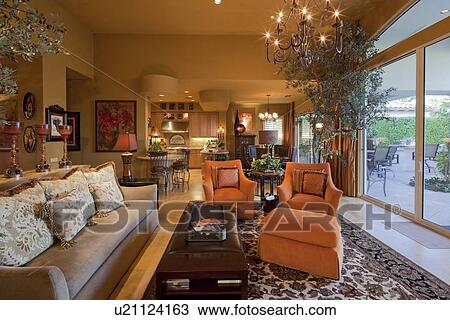 Stock Image - Seating furniture with chandelier in living room of manor house. Fotosearch