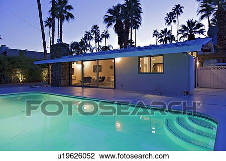 Swimming pool in front of luxury mansion View Large Photo Image Stock Image - Swimming pool in front of luxury mansion. Fotosearch