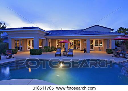 Stock Photography - Swimming pool in front of mansion. Fotosearch