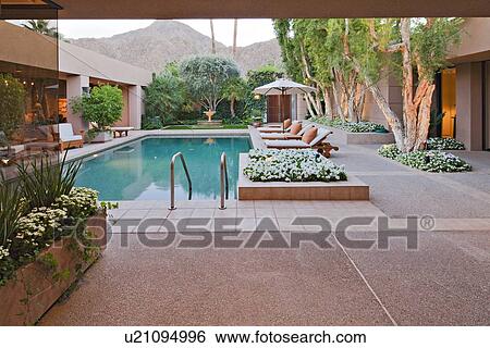 Stock Photograph - Swimming pool in luxury manor house. Fotosearch