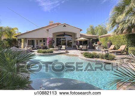 Stock Image - Swimming pool in luxury villa. Fotosearch