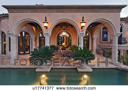 View of patio of with swimming pool in manor house View Large Photo Image Stock Photo - View of patio of with swimming pool in manor house. Fotosearch