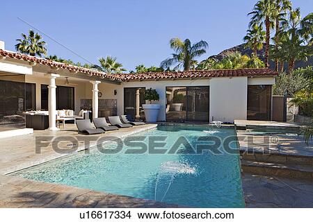 View of swimming pool with chaise lounge at manor house View Large Photo Image Picture - View of swimming pool with chaise lounge at manor house. Fotosearch