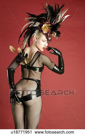 Back view of woman in leather and fishnet stockings looking back View Large Photo Image Stock Image - Back view of woman in leather and fishnet stockings looking back. Fotosearch