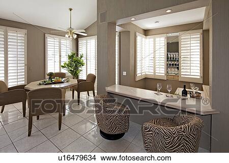 Picture - Bar counter with dining table and chair in luxurious villa. Fotosearch