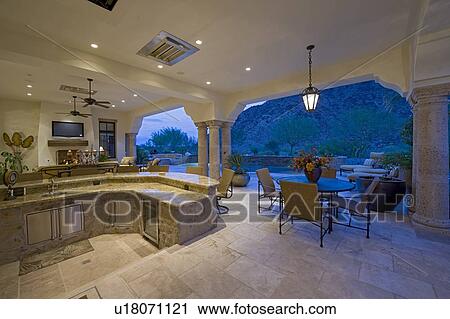 Bar counter with seating furniture in patio of luxury mansion View Large Photo Image Stock Image - Bar counter with seating furniture in patio of luxury mansion. Fotosearch