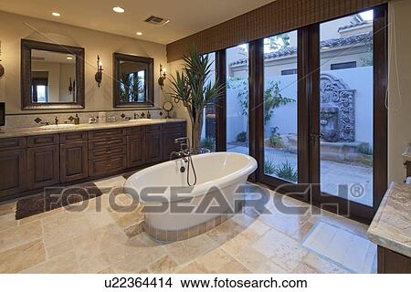 Bathtub in spacious bathroom of luxury villa View Large Photo Image Picture - Bathtub in spacious bathroom of luxury villa. Fotosearch