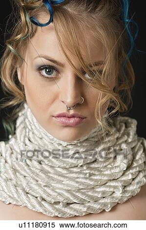 Beautiful young woman with rope around neck View Large Photo Image Stock Photography - Beautiful young woman with rope around neck. Fotosearch