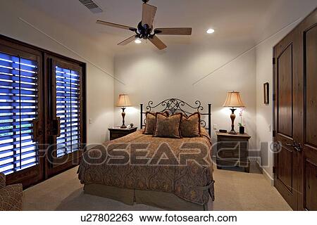 Stock Image - Bedroom interior of manor house. Fotosearch