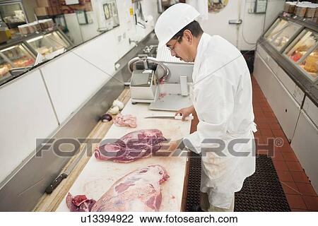 Butcher holding steak in store View Large Photo Image Stock Image - Butcher holding steak in store. Fotosearch