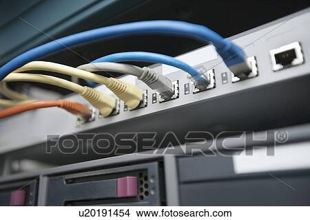 Close-up of data cable plug connected to servers in computer lab View Large Photo Image Picture - Close-up of data cable plug connected to servers in computer lab. Fotosearch