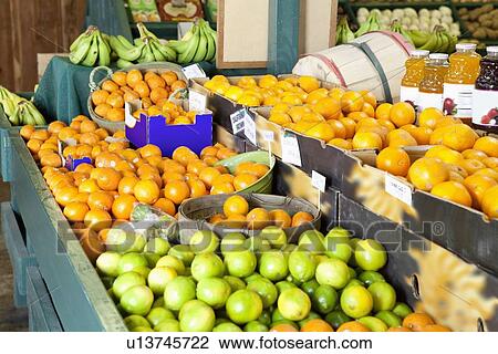 Stock Image - Close-up of fresh fruits on display in market. Fotosearch