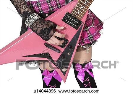 Close-up of punk woman with guitar over white background View Large Photo Image Stock Photograph - Close-up of punk woman with guitar over white background. Fotosearch
