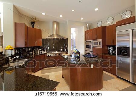 Stock Photography - Contemporary kitchen in luxury mansion. Fotosearch