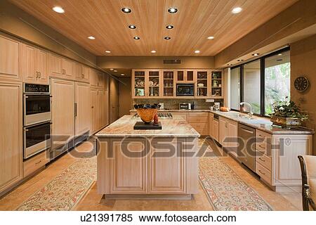Stock Photography - Contemporary kitchen in luxury villa. Fotosearch