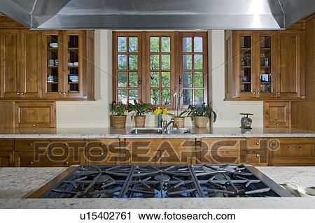 Contemporary kitchen stove in luxury mansion View Large Photo Image Stock Image - Contemporary kitchen stove in luxury mansion. Fotosearch