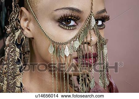 Picture - Cropped image of an African American woman wearing head ornament. Fotosearch