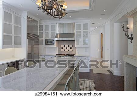 Dining table and chair in modern kitchen of luxury villa View Large Photo Image Stock Image - Dining table and chair in modern kitchen of luxury villa. Fotosearch