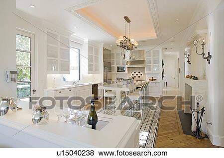 Stock Photo - Elegant white kitchen in luxury manor house. Fotosearch
