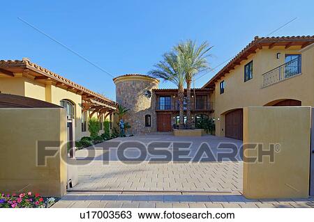 Stock Image - Entrance of luxurious manor house. Fotosearch