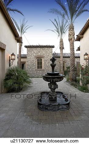 Stock Photo - Fountain in luxury villa's courtyard. Fotosearch