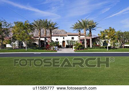 Stock Photo - Front entrance facade of luxury manor house. Fotosearch