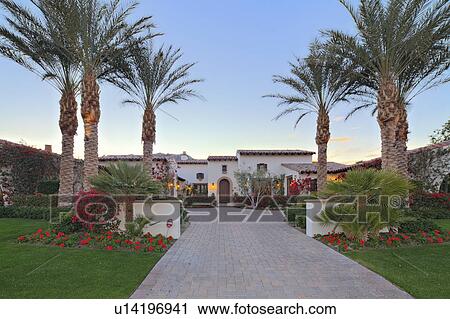 Stock Image - Front entrance of luxury manor house. Fotosearch
