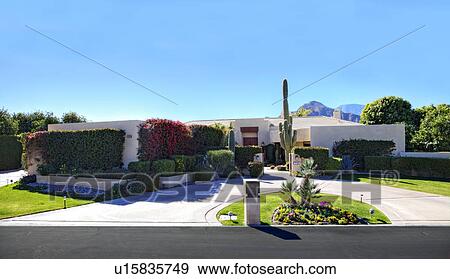 Stock Photo - Front entrance of luxury villa. Fotosearch
