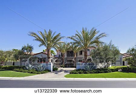 Stock Photo - Front view of luxurious villa. Fotosearch