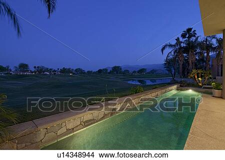 Idyllic view of lawn in night from manor house View Large Photo Image Picture - Idyllic view of lawn in night from manor house. Fotosearch