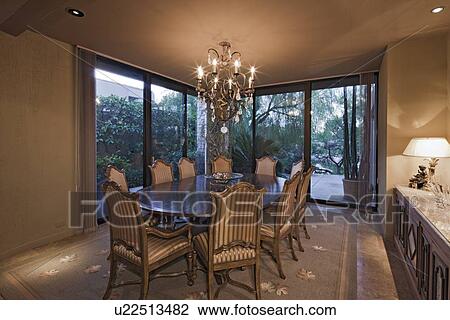 Stock Image - Interior of a dining room in a luxury villa. Fotosearch